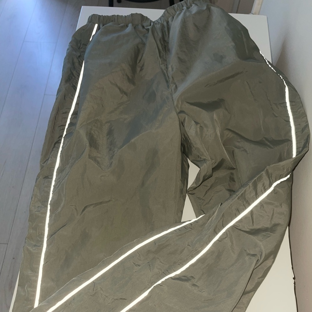 Olive green windbreaker pants